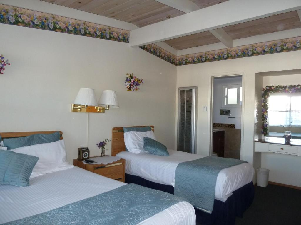 Bright guest room at Sundown Inn